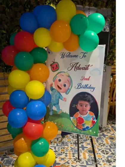 A personalized welcome sign for Advait's Cocomelon party, featuring his photo and favorite character to greet guests as they arrive.