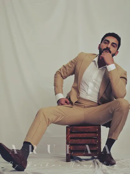 A modern, stylish pose that highlights the versatility of a classic suit. It's all about how you wear it, and Gagan carries this look with immense confidence.