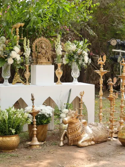 The complete traditional decor setup, including the Ganesha altar, Nandi statue, and an array of brass lamps, creating a truly sacred space.