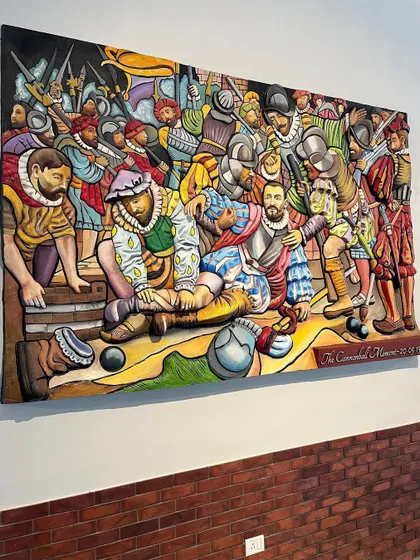 Another shot of the colorful, narrative mural, capturing the energy and detail of the full composition.