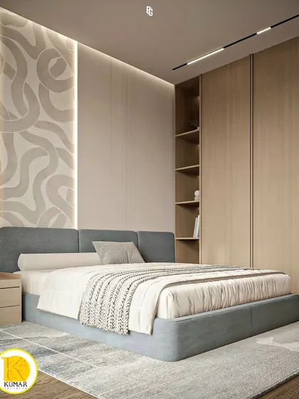 A bedroom with a unique textured accent wall behind the bed.