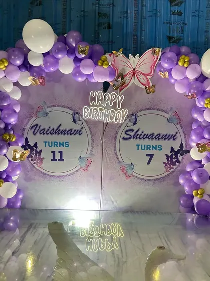 A full view of the joint Butterfly-themed birthday decoration, perfect for siblings.