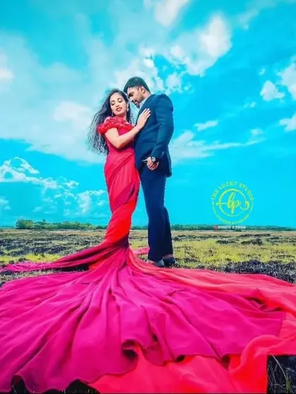 A low-angle view that makes the couple look heroic and the gown's trail seem endless. I work with photographers to style these shots for maximum impact.