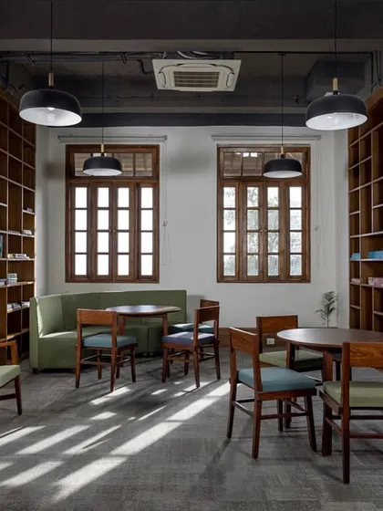 This cozy nook within a transformed heritage building at Woodstock School serves as a quiet space for study and collaboration. We restored the original windows and used natural materials to create a warm, inviting atmosphere that connects students with their surroundings.