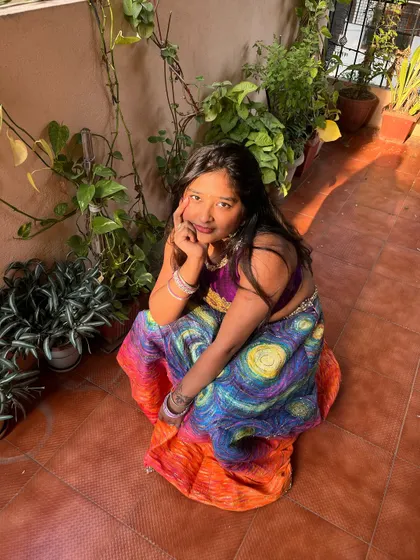 A quiet moment with my creation. The finished lehenga captures the beautiful swirls of a starry night and the warm gradient of a sunset, all hand-painted.