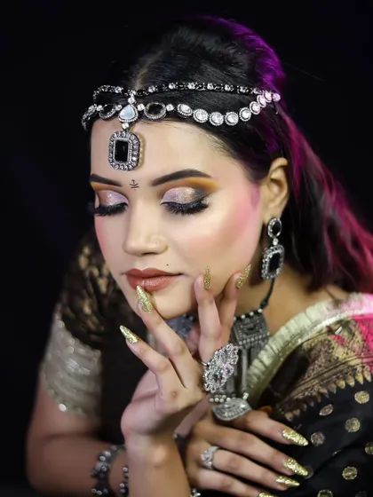 An eyes-closed pose to highlight the beautiful blending of the warm-toned eyeshadow.