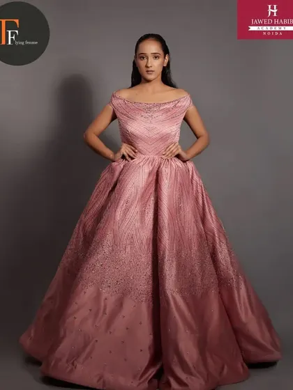 A full-length view of the stunning pink gown, with our students' work completing the fairytale look.