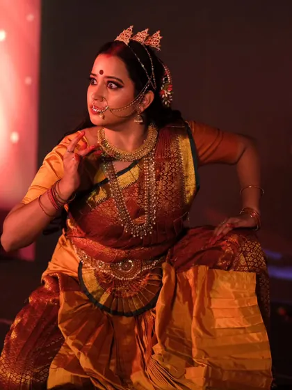A dynamic action shot from the performance. The makeup remains flawless even during movement, demonstrating the professional quality and longevity of the products I use for stage and events.