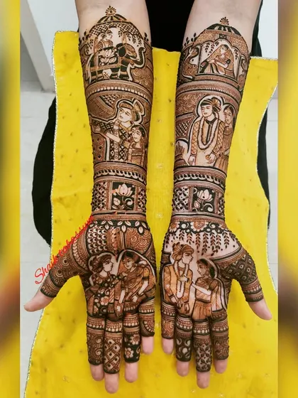 A royal-themed bridal mehendi with the groom on an elephant and the bride looking out from a palace window. The palms show the couple together, completing the regal story.