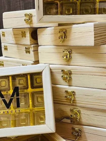 Another view of the custom wooden chocolate boxes, stacked and ready for a corporate order.