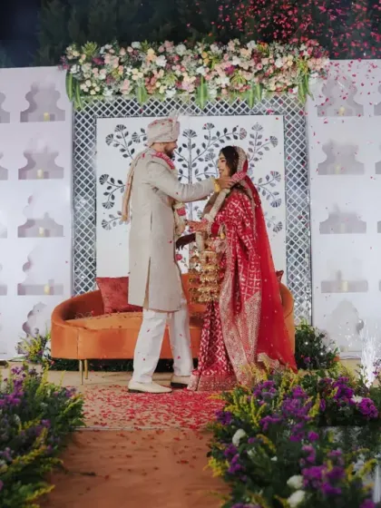 The Varmala exchange on a Sheesh Mahal-inspired stage, with cold pyro adding a touch of sparkle.