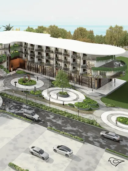 This aerial view shows the hotel's relationship with the sea and its extensive, thoughtfully designed landscape. The circular motifs in the driveway and gardens echo the fluid forms of the building's architecture.