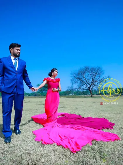 A walking shot that captures the movement and elegance of the flowing pink gown. This is a popular choice for pre-wedding shoots in open landscapes.