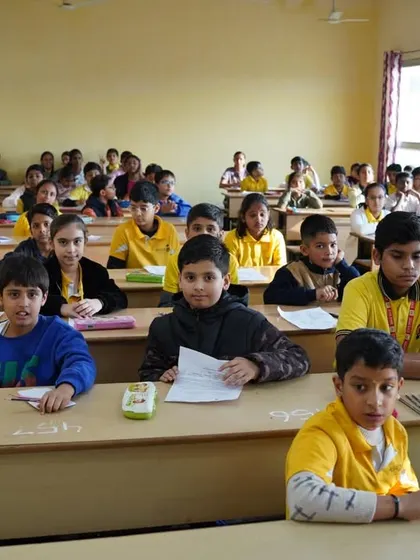 A classroom of students looking up, ready and waiting for the next challenge.