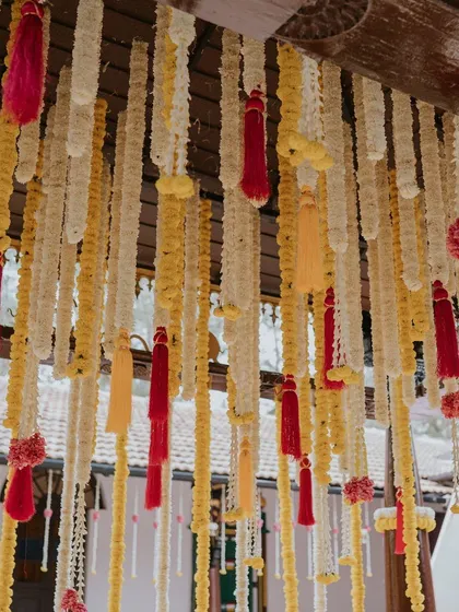 A close-up of the hanging floral tassels, showing the intricate details and vibrant colors that add texture to the decor.