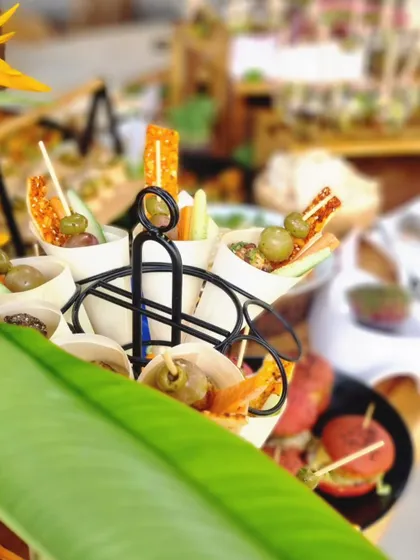 A close-up of our appetizer cones, filled with delicious bites and arranged in a stylish holder. This is a perfect example of our creative and practical food presentation.