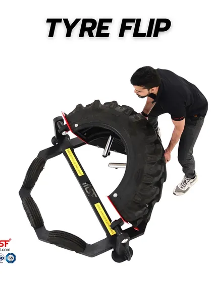 A user demonstrates the proper lifting technique for the Tyre Flip machine.