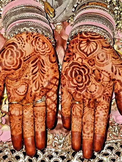 A gorgeous, rich design for a 'Baat Pakki' or engagement ceremony. The deep stain and intricate floral patterns are perfect for the celebration.