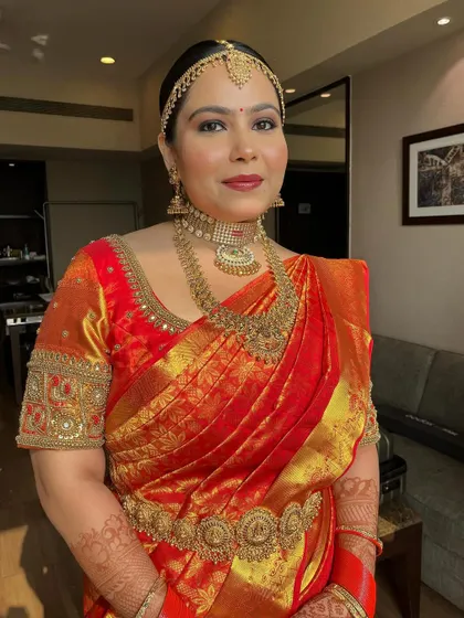 A final portrait showing the complete, breathtaking look. The bride embodies the aura of a South Indian goddess.