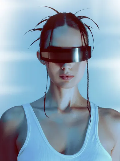 A close-up beauty shot highlighting the futuristic visor and clean makeup. This type of image adds a modern, high-fashion edge to a model's book.