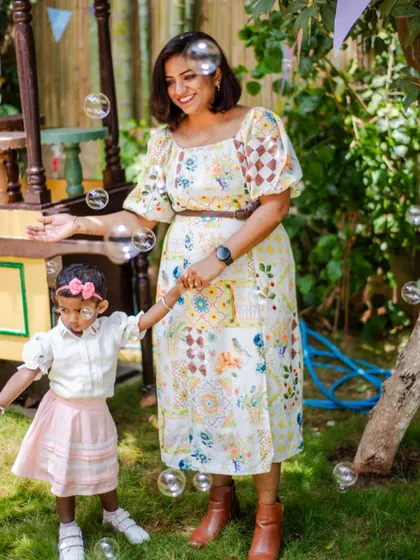 A sweet moment between mother and daughter enjoying the bubble-filled garden. My goal is to create a beautiful and fun environment for you to make memories with your loved ones.