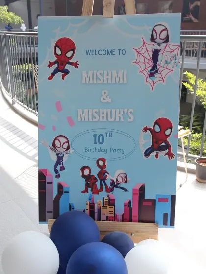A welcome sign for a Spidey and His Amazing Friends themed 10th birthday party for Mishmi and Mishuk.