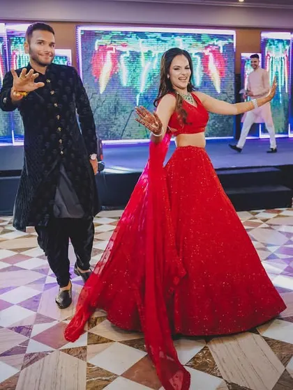 A snapshot from a high-energy sangeet entry. The couple danced their way in, setting the tone for a night of celebration.