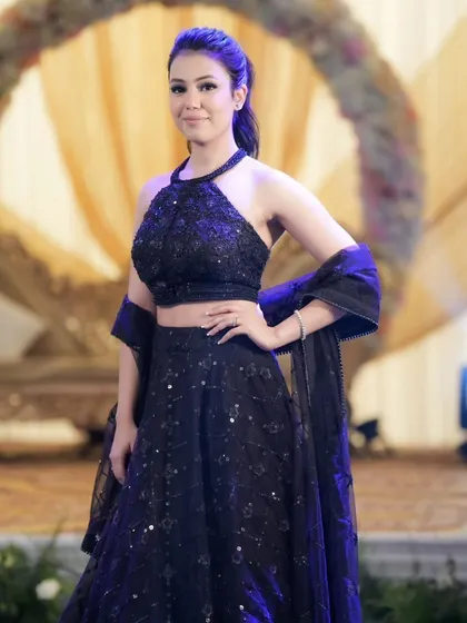 An elegant guest posing at a cocktail event. I make sure to capture the style and grace of not just the couple, but their loved ones too.