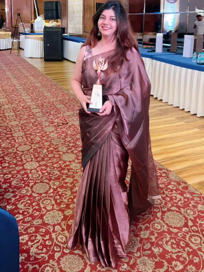 Dressed for success, this client is ready for her awards function. I draped her in this elegant organza saree with tight pleats to create a sharp, professional, and celebratory look.
