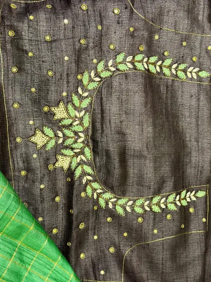 The back design of the embroidered Tussar blouse. I love creating these intricate patterns that add a surprise element to the outfit. This piece comes with two blouse options for versatility.