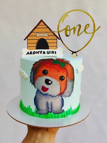 A cute painted puppy cake for a little one's first birthday. I hand-painted the puppy onto the buttercream for a unique, artistic touch.
