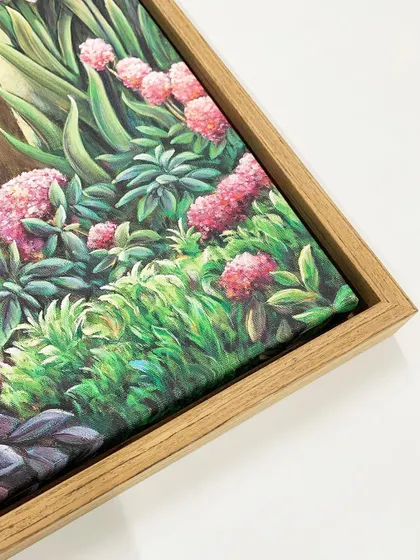 A close-up of the corner of the veneer wooden floater frame, showing the canvas texture and the clean, modern presentation.