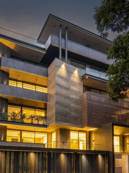 Another night shot revealing the captivating glow of our facade design. The lighting strategy is key to highlighting the architectural forms and creating a warm, welcoming ambiance.