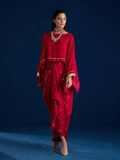 A dynamic walking pose in the Aapro Kimaya Draped Skirt Set, showing the garment in motion.