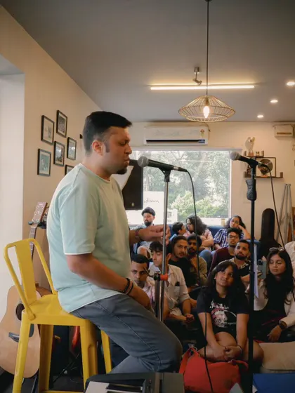 A student sharing a story with the audience during a performance. We teach our students that performance is about connection, not just perfection.