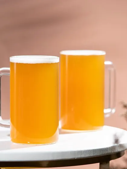 Beer mugs styled on a modern white tray. This clean and minimalist setup is perfect for e-commerce product listings.