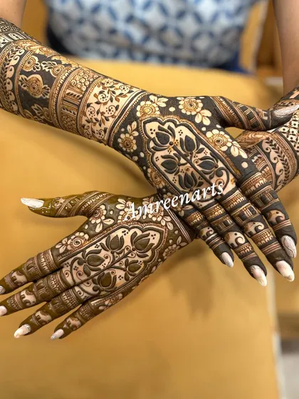 A beautiful example of symmetrical design, with matching floral and lotus patterns on both hands, creating a sense of harmony and balance.