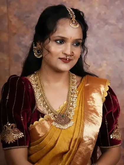 A beautiful client in a traditional look, featuring one of our custom velvet blouses.