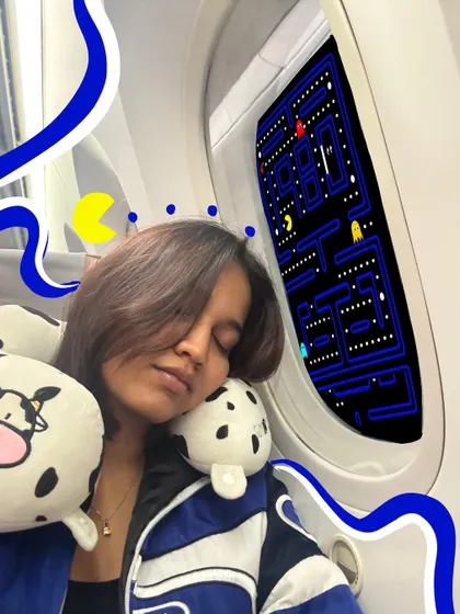 Even sleeping on a plane can be an adventure. I turned the window into a game of Pac-Man with some fun doodles.