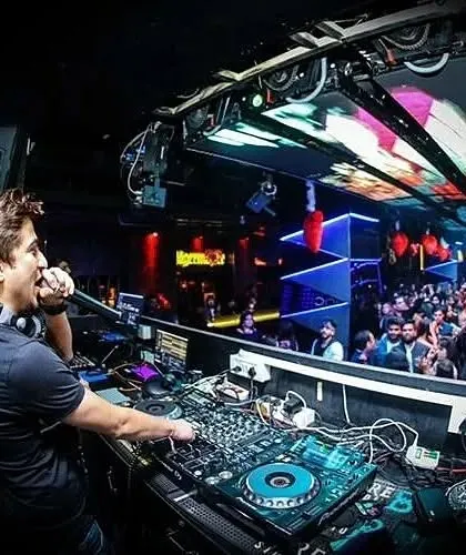 On the mic, interacting with the Saturday night crowd at Privee'. A DJ's job is to be the life of the party.