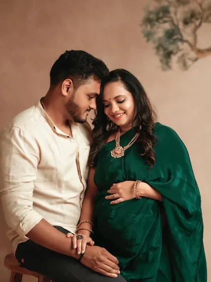 A sweet and intimate moment between this expecting couple. The love and happiness they share are beautifully captured in this traditional portrait.