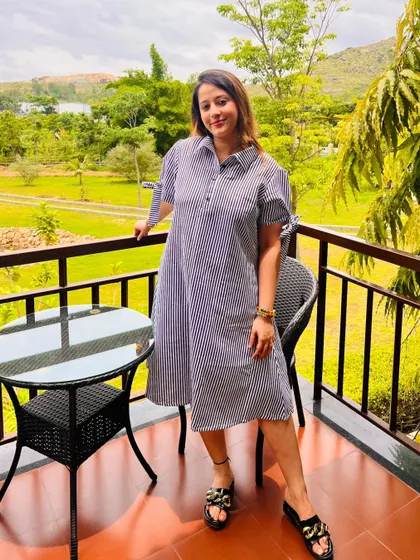 A guest enjoying the view from her private balcony. Each room has outdoor space, allowing you to feel connected to the natural beauty of the retreat right from your own room.