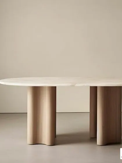 A minimalist dining table with a stone top and curved wooden legs. The simple, clean design highlights the natural beauty of the materials.
