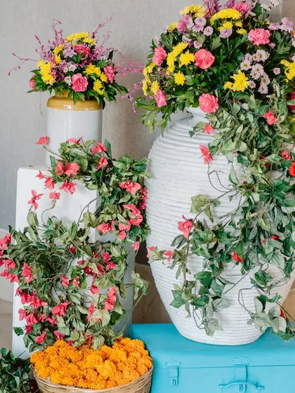 A beautiful arrangement of colorful flowers in modern vases, showcasing the blend of contemporary and traditional decor.