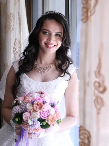 Crystal, looking absolutely perfect. Her soft waves, delicate tiara, and radiant makeup came together to create a truly memorable bridal style.