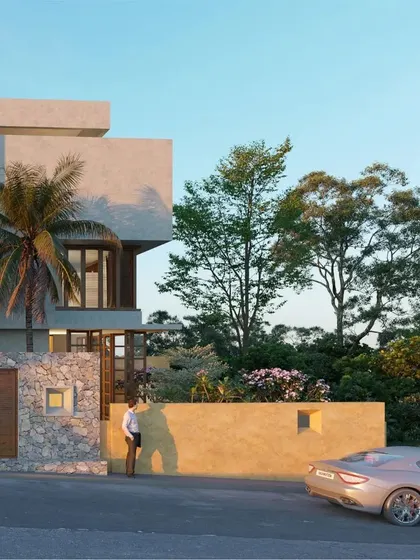 The street-facing view of the Belagavi home concept. We integrated landscaping and boundary walls to create a gentle transition from the public street to the private residence, using natural materials to blend the building with its surroundings.