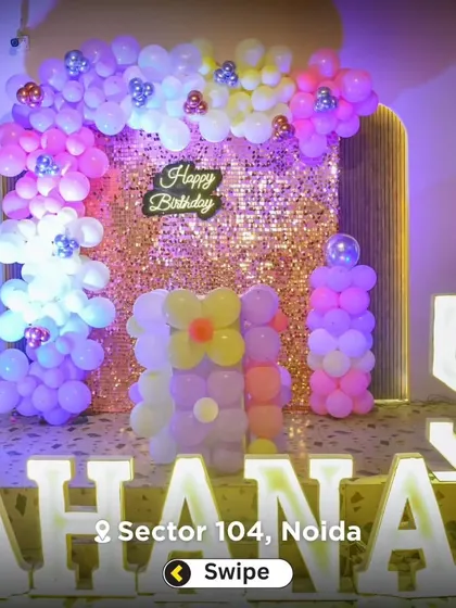 A personalized party setup with large, illuminated marquee letters spelling out the birthday girl's name, "AHANA," and the number 5.