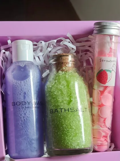 A simple and refreshing gift set with lavender body wash, green apple bath salts, and a tube of travel-sized soap petals.