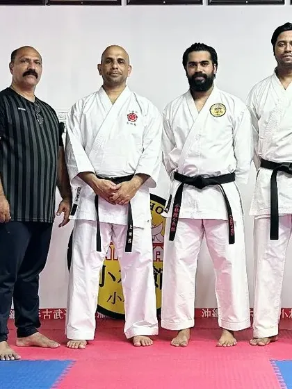 Standing with the senior team after our intensive weapons training session.