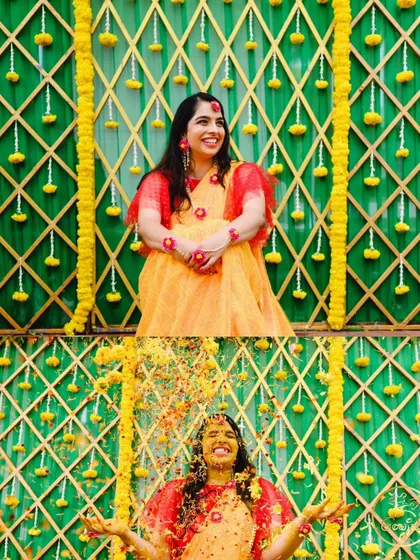 The bride enjoying a shower of flower petals against a vibrant green and yellow backdrop.
